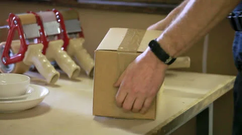 Packaging a box for shipping Stockbeeldmateriaal 24523035