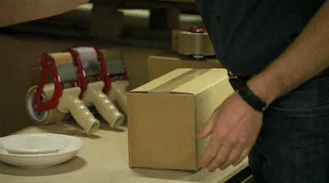 Packaging a box for shipping Stock Footage 24524890