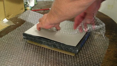 Packaging an eBay parcel to send in the mail. Video stock 99127956