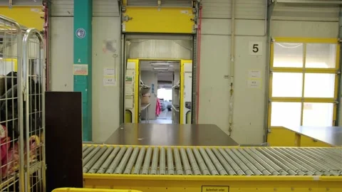 Packaging lines in a warehouse of a modern factory. A warehouse work department Stock Footage 203902489