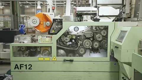 Packaging machine on a conveyor line Stock Footage 208845830