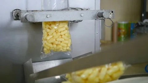 Packaging machine at workshop of food factory Process of packaging candy in foil Stock Footage