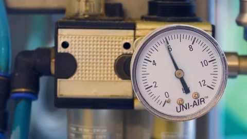 Packaging machine at workshop of food factory, Analog arrow indicator close up. Stock Footage 129872860