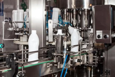 Packaging milk bottles line Stock Photos
