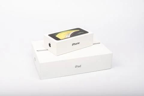 Packaging of the new iPhone SE 2020 and iPad from Apple Stock Photos