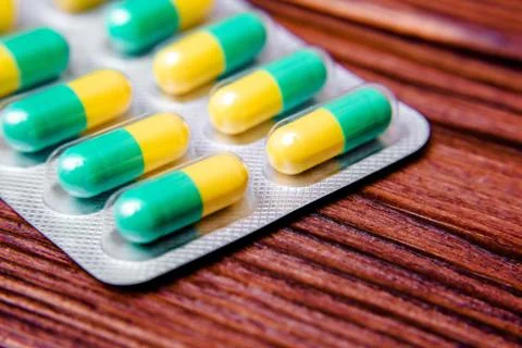 Packaging with pills is on a brown background 库存照片