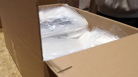 Packaging of plastic bags in export carton Stock Footage 72672238