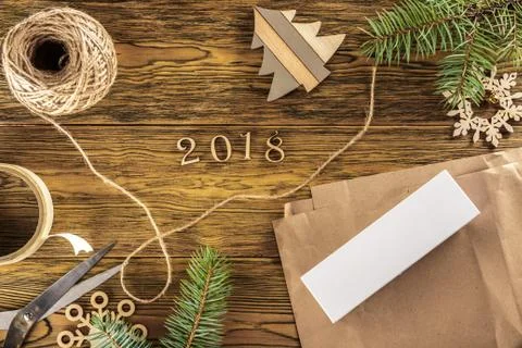 The packaging process of a smartphone as a gift. The new year 2018. The view Stock Photos