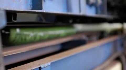 The packaging with the products passes through the sealer. Belt press for sea Stock Footage 172452844