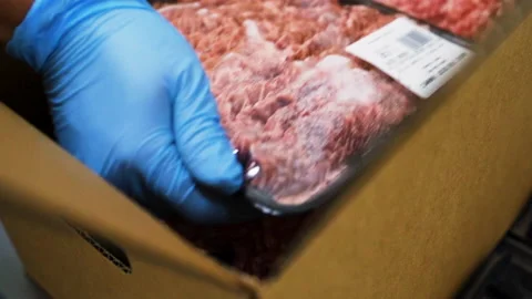 Packaging raw meat into a carton box Stock Footage 135295760