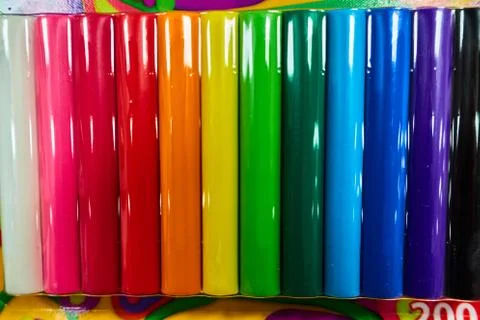 Packaging of sealed multi-colored plasticine on the store shelf Stock Photos