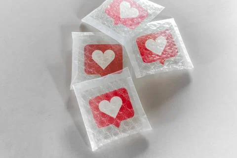 Packaging social Likes icon with bubble wrap Packaging social symbols and ... Stock Photos