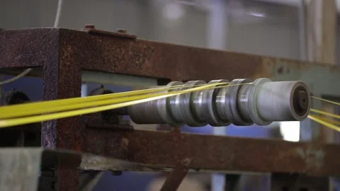 Packaging strap is passing to roller alignment system in machine Stock Footage 305215347