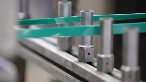 Packaging strap is passing water cooling tank in the machine Stock Footage 305837545