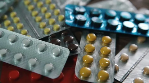 Packaging of tablets and pills on the table. Medicine Stock Footage 61071959
