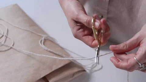 Packaging things in craft eco paper and rope bonding. Stock Footage 193427916