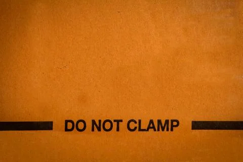 Packaging word to indicate not to clamp. Do not clamp instruction Stock Photos