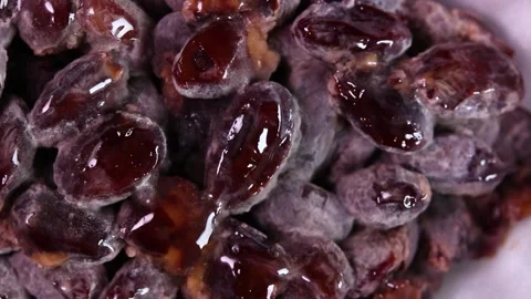 Packed black bean natto close up rotating Stock Footage 315920326