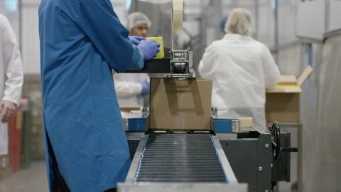 Packed boxes being labeled in cosmetic factory Stock Footage 107989922