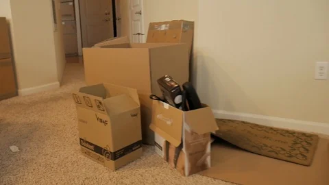 Packed Boxes Set Aside Apartment Move Handheld Shot Stock Footage 129499788