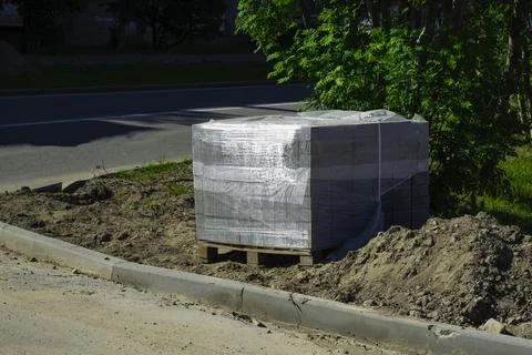 Packed Bricks on Pallet by the Road Stock Photos