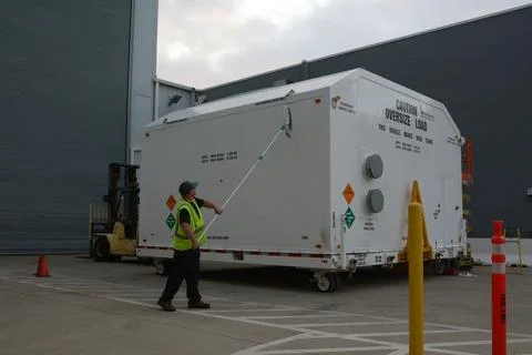 Packed in its shipping container, the spacecraft destined to fly astronauts.. Stock Photos