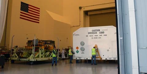 Packed in its shipping container, the spacecraft destined to fly astronauts.. Stock Photos