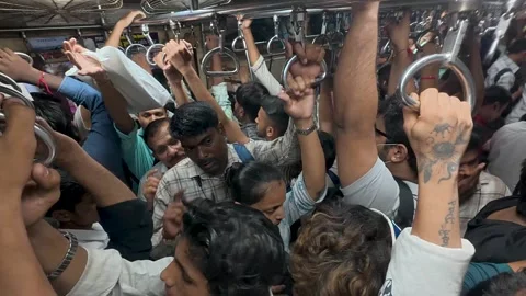 Packed Local Train Carriage With Standing Commuters in Mumbai Stock Footage 347519061