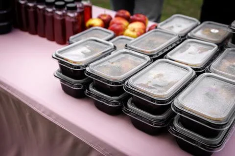 Packed meal containers on table ready for delivery Stock Photos