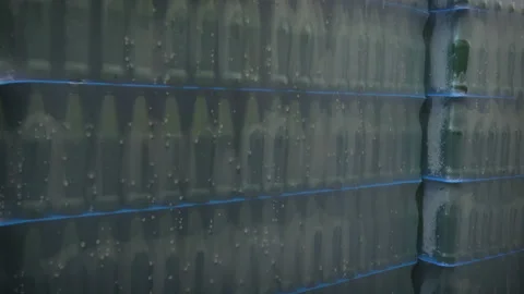 Packed stack of bottles of beer in factory territory Stock Footage 95759075