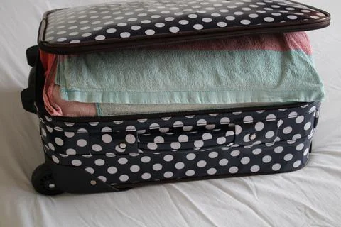 Packed suitcase Stock Photos