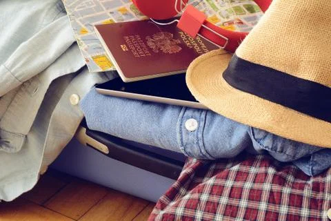 Packed suitcase of vacation items Stock Photos
