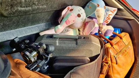 Packed Trunk with Camera Gear and Plush Toys Stock Photos