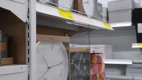 Packed wall clocks on store shelves. Stock Footage 232984164