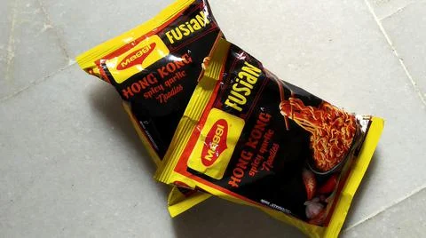 Packets of Maggi placed on white background Foto stock