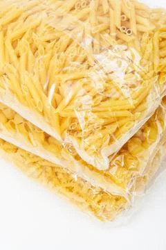 Packets of pasta on white background Foto stock