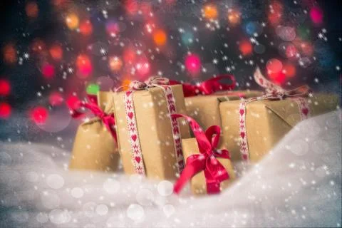 Packets presents christmas background colored lights gift snow snowing Stock Photos