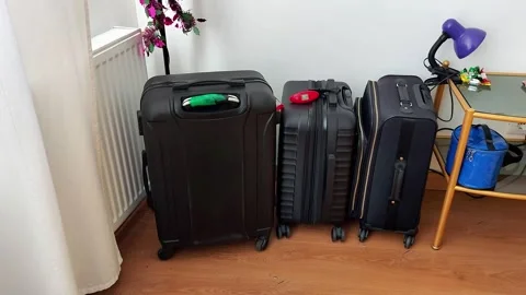 Packing for Adventure: Three Suitcases Ready for the Big Trip 스톡 동영상 328285702