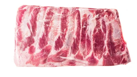 Packing and Freezing a Portion of Ribs 4K Stock Footage 328609917