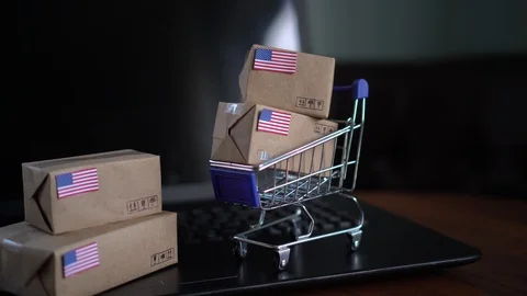 Packing and Packaging Boxes with a flag of United States of America Stock Footage 102363171