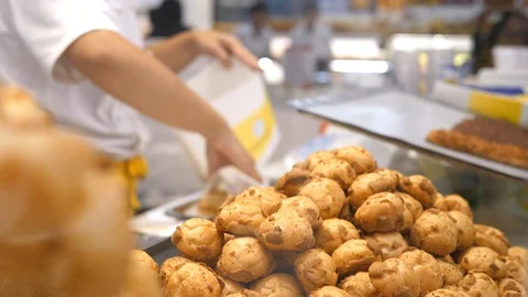 Packing And Wrapping Pastry Eclairs At Supermarket Stock Footage 97844151
