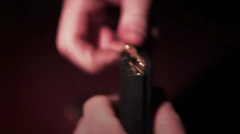 Packing automatic gun magazine with bullets - 3 shots Stock Footage 37584914