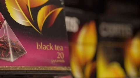 Packing of black tea with a taste of grapes close-up Stock Footage 75475973