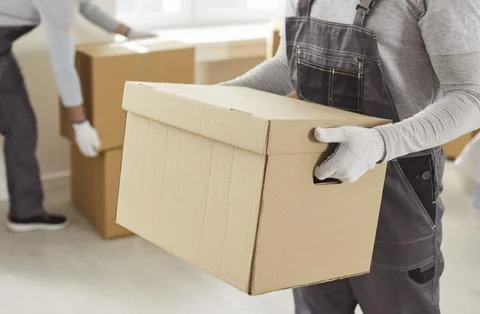 Packing boxes close up, moving delivery pack service, movers team moving Foto stock