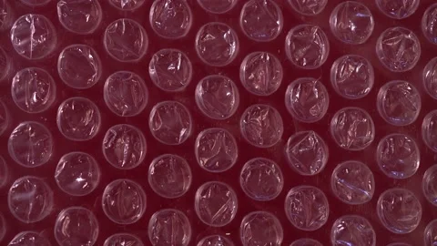 Packing bubble wrap. Slide shot of polyethylene packaging film texture. Slow  Stock Footage 204702270