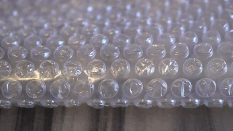 Packing bubble wrap. Slide shot of polyethylene packaging film texture. Slow  Stock Footage 218580043