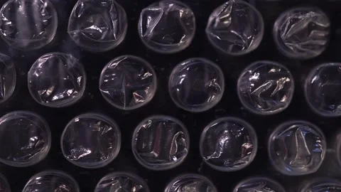 Packing bubble wrap. Slide shot of polyethylene packaging film texture. Slow  Stock Footage 218580103