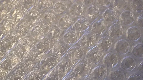 Packing bubble wrap. Slide shot of polyethylene packaging film. Stock Footage 221854383