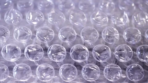 Packing bubble wrap. Slide shot of polyethylene packaging film. Video stock 244334860
