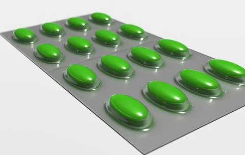 Packing with colored pills on a white background close-up. Stock Photos